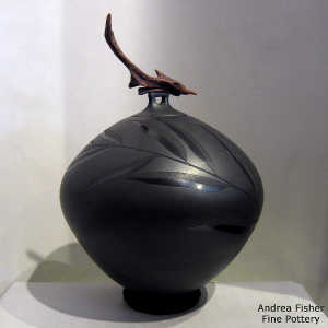 Sgraffito bamboo design on a black on black jar with a driftwood lid