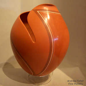 Fine line design on a polychrome jar with an organic opening