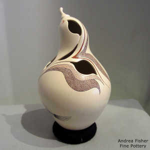 Sgraffito and painted geometric and hummingbird design on a polychrome quail effigy with organic cutouts