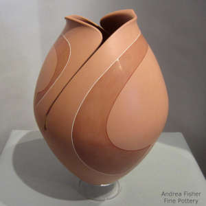An organic opening and ribbon design on a polychrome jar