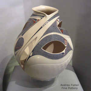 Painted geometric and hummingbird design on a polychrome jar with an organic opening