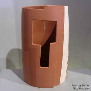 Sculptural polychrome cylinder with geometric design and cutouts