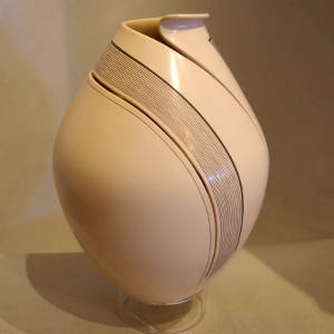 Organic opening, fine line cutout and fine line design on a white jar