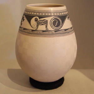 Sgraffito geometric design and band of Mimbres designs on a white jar