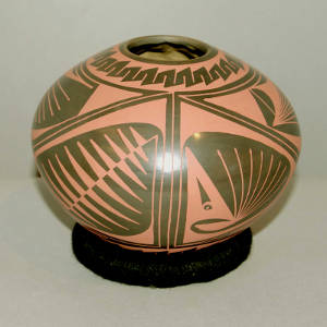 Geometric design on a black on red jar
