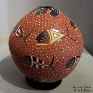 Fish and fish scale motif on a polychrome jar