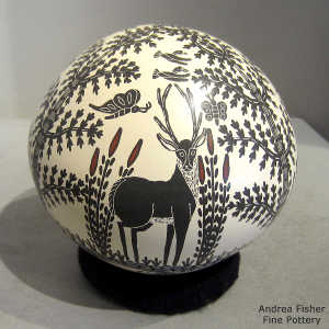 Sgraffito and painted wildlife and nature design on a polychrome seed pot