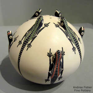 Sgraffito, painted and formed lizard design on a polychrome seed pot