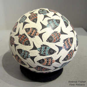Sgraffito and painted fish design on a polychrome seed pot