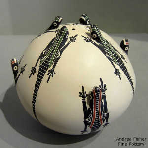 Sgraffito, painted and raised lizard design on a polychrome seed pot