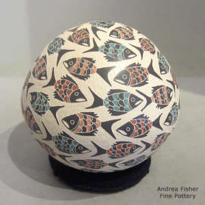 Sgraffito and painted fish design on a polychrome seed pot