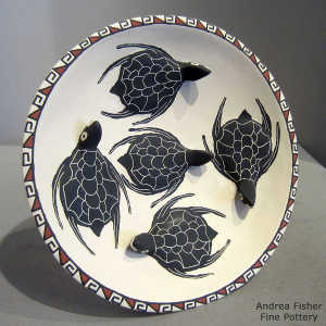 Sgraffito, painted and raised turtle design on a self-standing polychrome plate