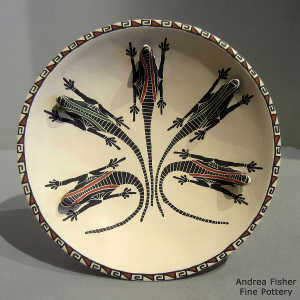 Sgraffito, painted and formed lizard design on a self-standing polychrome plate