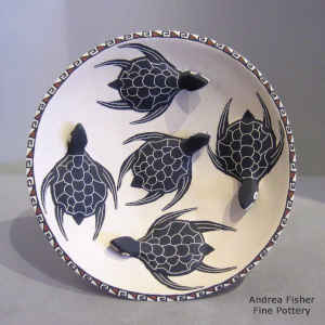 Applique, sgraffito and painted turtle and geometric design on a free-standing plate