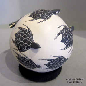 Polychrome seed pot decorated with a sgraffito, painted and applique turtle design