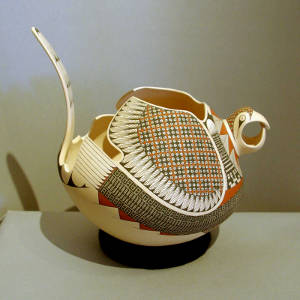 Geometric designs on a sculptured bird effigy