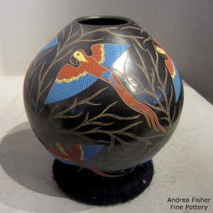 Sgraffito and painted parrot and vine motif on a polychrome jar