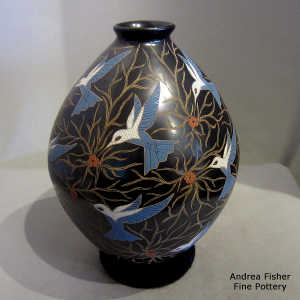 Sgraffito and painted bluebird and branches motif on a polychrome jar