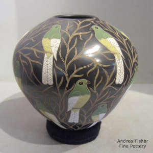 Sgraffito and painted bird and branch motif on a polychrome jar