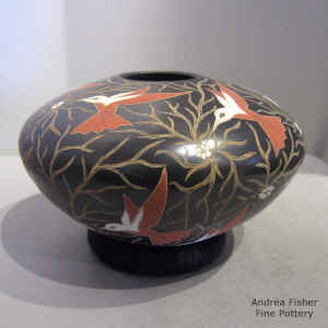 Polychrome jar with sgraffito and painted bird, flower and branch design