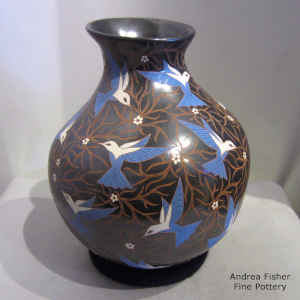 Polychrome jar with sgraffito and painted bird, flower and branch design