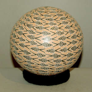 Sgraffito and painted fish design on a polychrome seed pot