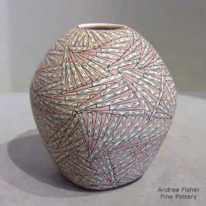 Geometric design on a squarish polychrome seed pot