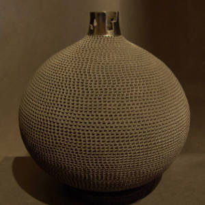 Kiva step neck on a corrugated black jar