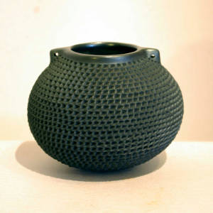 Handles on a corrugated black jar