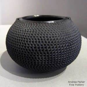 Handles on a corrugated black jar