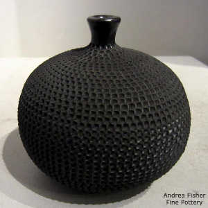 A corrugated surface on a thin-neck black jar