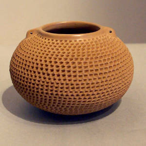 Corrugated surface on a brown jar