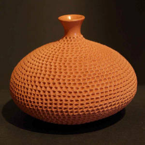 Corrugated red jar with a thin neck
