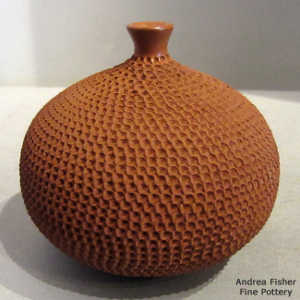 Corrugated surface on a red jar