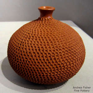 Red jar with a corrugated surface