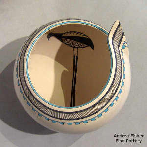 Bird design inside with a band of geometric design around the folded rim of a polychrome jar