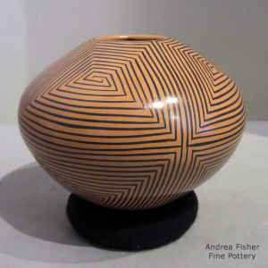 Spiral geometric design on a brown on tan jar