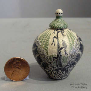 Sgraffito and painted nature design on a miniature polychrome lidded jar
