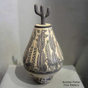 Sgraffito and painted desert nature and wildlife motif on a lidded polychrome jar