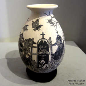 Sgraffito Day of the Dead motif on a black and white jar
