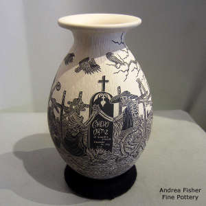 Sgraffito Day of the Dead motif on a black and white jar