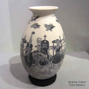Sgraffito Day of the Dead motif on a black and white jar
