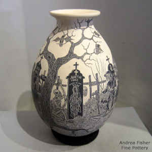 Sgraffito Day of the Dead motif on a black and white jar