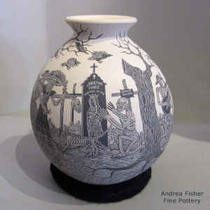 Sgraffito Day of the Dead motif on a black and white jar