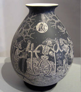 Sgraffito Night of the Dead motif on a black and white jar