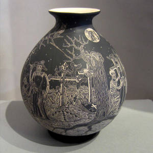 Sgraffito Night of the Dead motif on a black and white jar