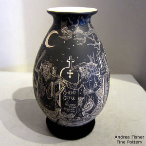 Sgraffito Night of the Dead motif on a black and beige jar