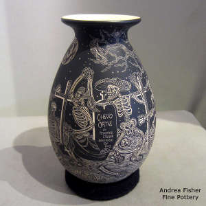 Sgraffito Night of the Dead design on a black and white jar