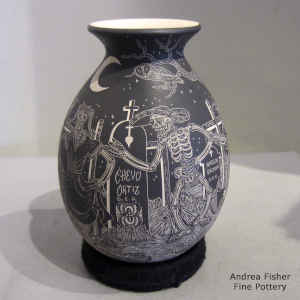 Sgraffito Night of the Dead motif on a black and white jar
