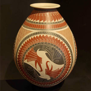 Sgraffito and painted geometric design on a polychrome jar